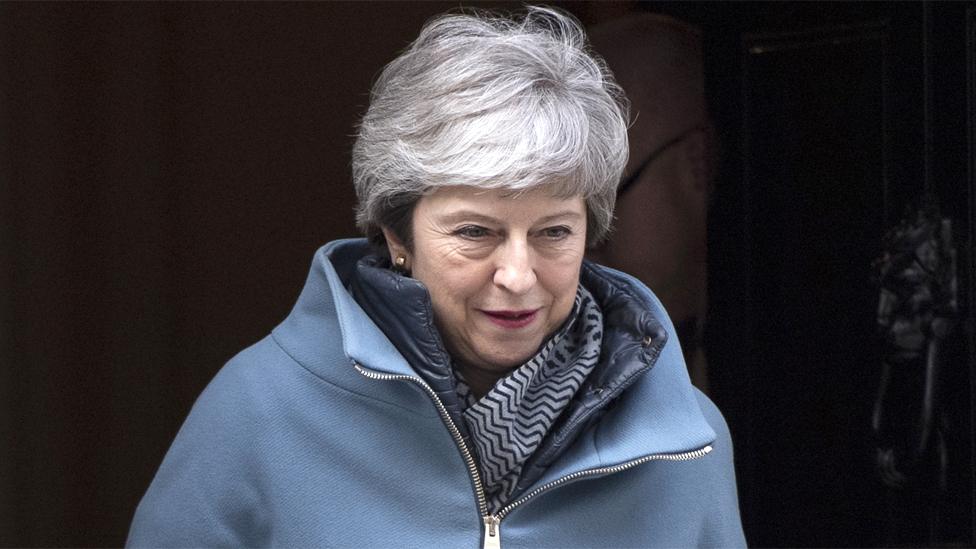 Theresa May leaves 10 Downing Street on 26 March