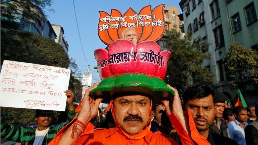 A Bharatiya Janata Party (BJP) supporter wears a hat with the party's symbol lotus in Kolkata on 30 January 2019