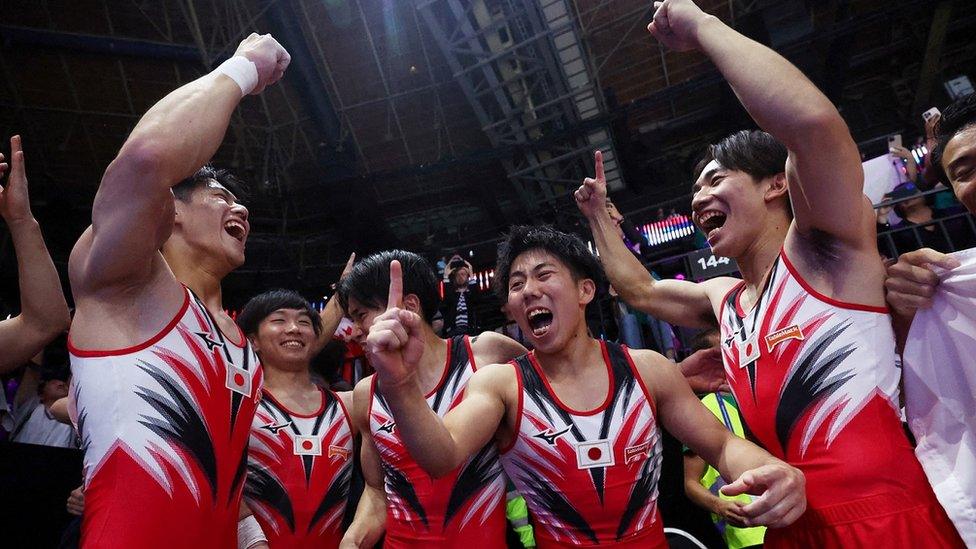 japan-mens-gymnastics-team-celebrating.