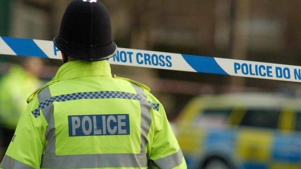 police in high viz jacket