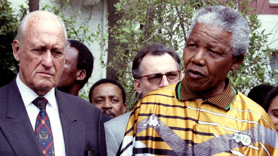 South African President Nelson Mandela speaks next to Fifa President Joao Havelange (L) in South Africa - 12 January 1996