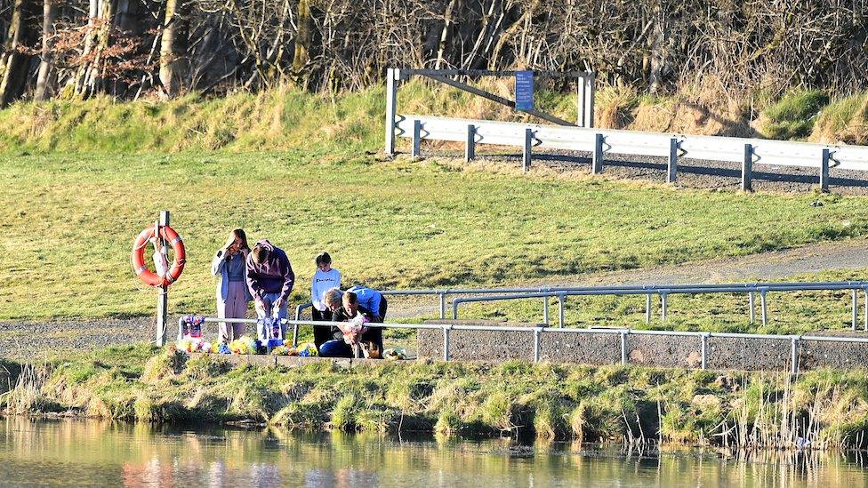 Flowers being laid at the North Woodburn Reservoir near Carrickfergus