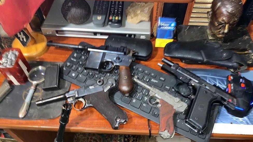 Nazi objects and weapons are seen in a home of an alleged paedophile in Rio de Janeiro