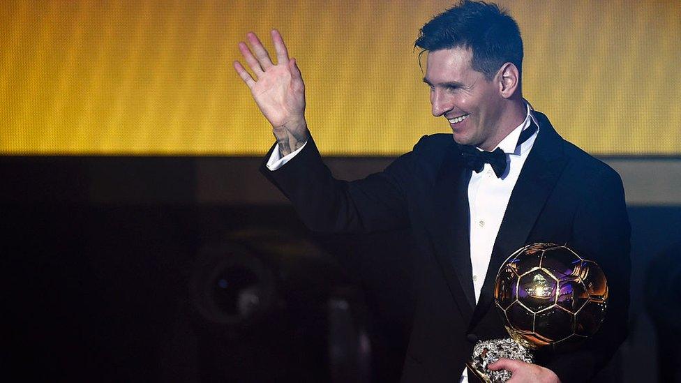 Messi with his 2014 award.