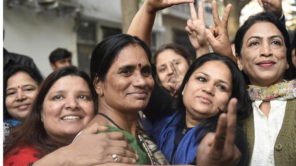 Asha Devi celebrates with her neighbours after the four convicts were hanged on March 20, 2020 in Delhi