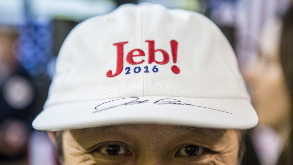 A supporter wears a hat autographed by Republican presidential candidate Jeb Bush at a campaign event at his local field office on January 31, 2016 in Hiawatha, Iowa.