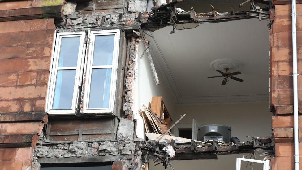 The front of a block of flat in Glasgow that had been due to be demolished was brought down