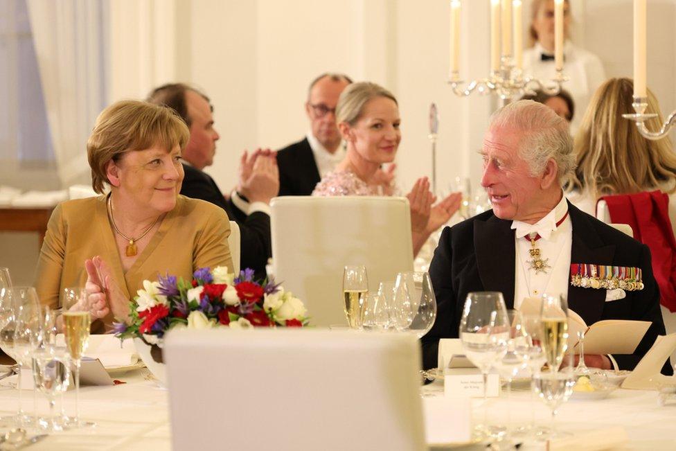 Former German Chancellor Angela Merkel and Britain's King Charles III attend a state banquet at Schloss Bellevue presidential palace in Berlin