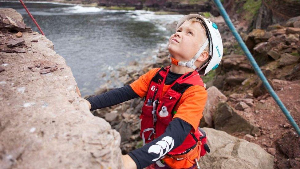 Edward Mills climbing