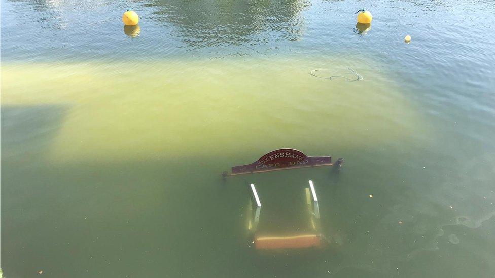 Cafe sinks in harbour