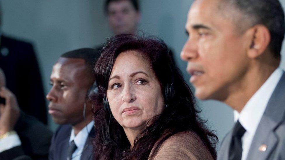 Miriam Celeya, second from right, listens President Barack Obama speaks during their meeting at the U.S. Embassy, Tuesday, March 22, 2016, in Havana, Cuba