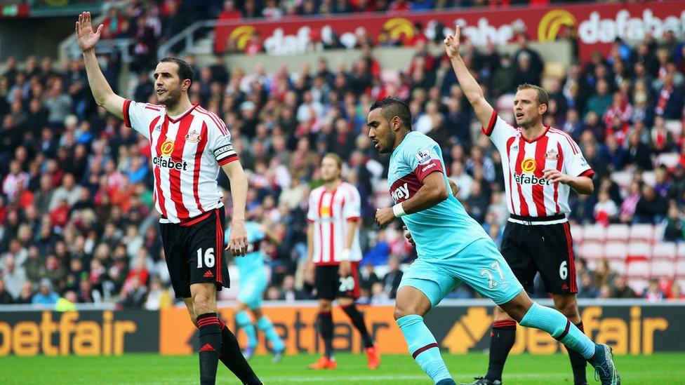 Dimitri Payet of West Ham (centre) celebrates scoring his team's second goal during the Barclays Premier League match against Sunderland on 3 October