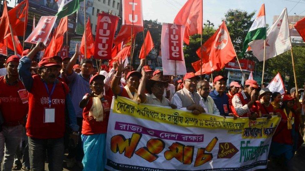 Indian activists of Left wing Trade unions along with others unions attend a rally organised to protest against the Citizenship Amendment Bill 2019 and National Register of Citizens (NRC) implemented by the Bharatiya Janata Party (BJP) led central government, in Siliguri on December 10, 2019. -