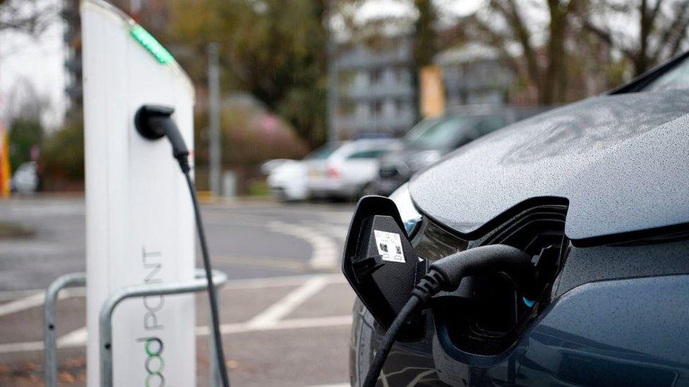 Electric vehicles (EV) charge at a charging station in east London on November 18, 2020