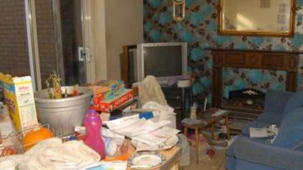 The cluttered living room at Hakeem's home on Long Acre