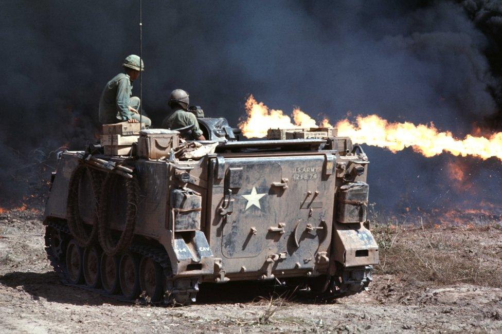 An armoured personnel carrier with a flamethrower during a deforestation mission outside the city of Ben Suc in Vietnam in 1966.