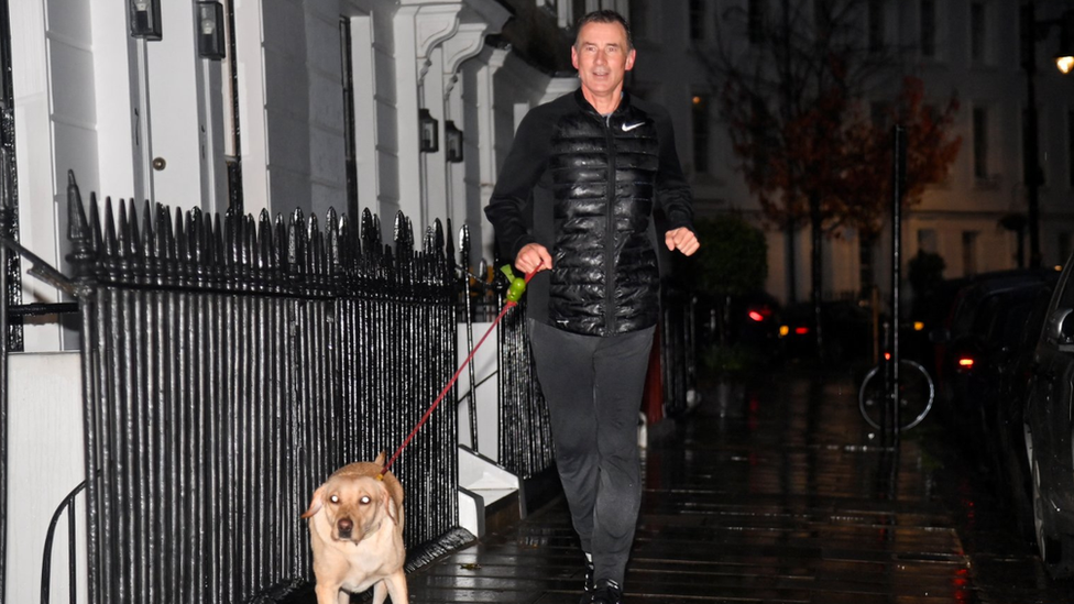 Jeremy Hunt with his dog on a run