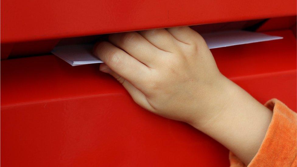 hand in letterbox