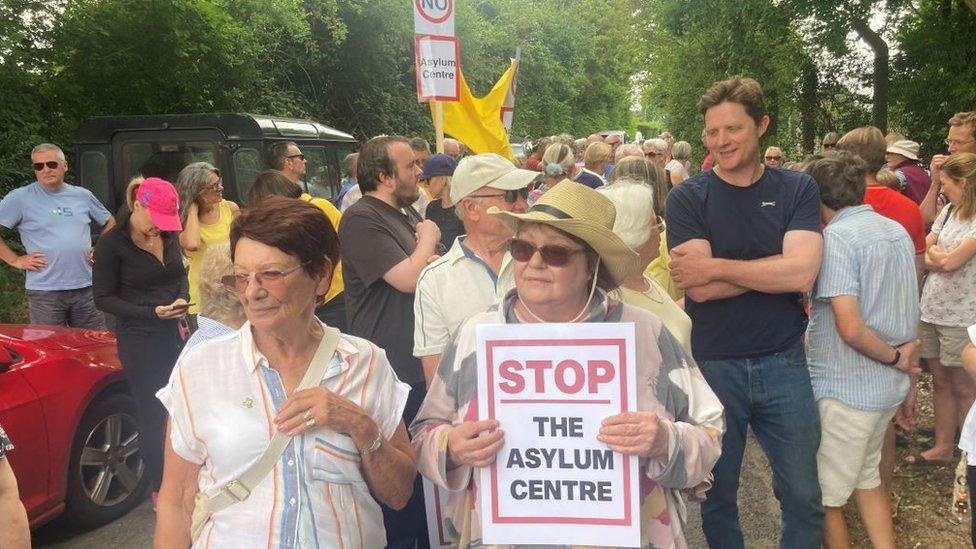 Protesters in Wethersfield, Essex holding banners