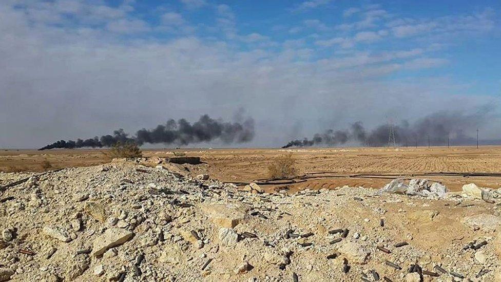 Smoke rises following a US-led coalition air strike on Islamic State positions outside Haditha, Iraq (5 January 2016)