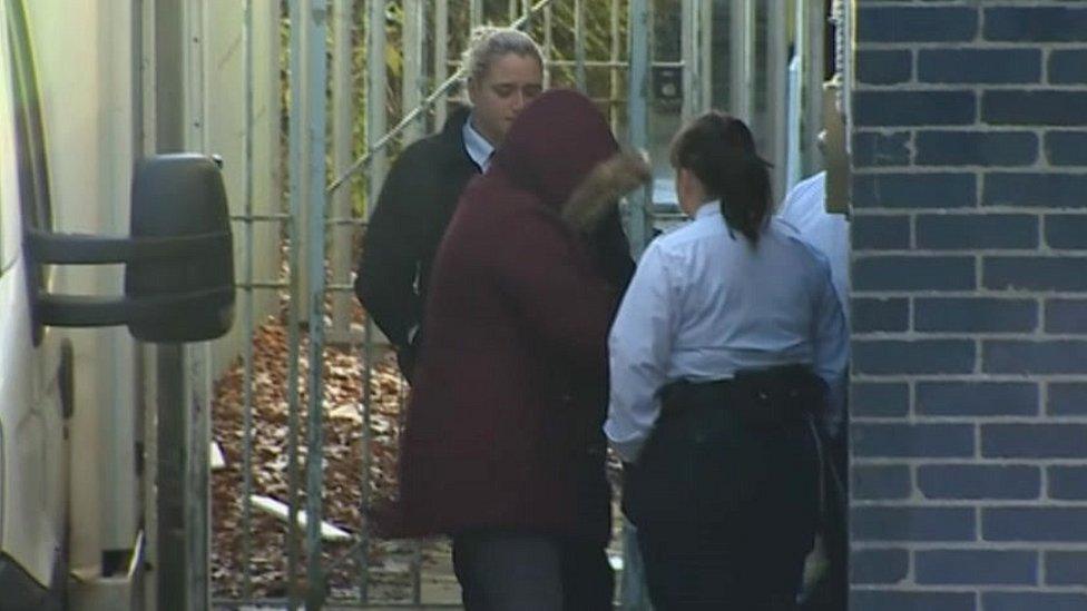 Hannah Turtle is escorted into Mold Crown Court on the first day of her trial