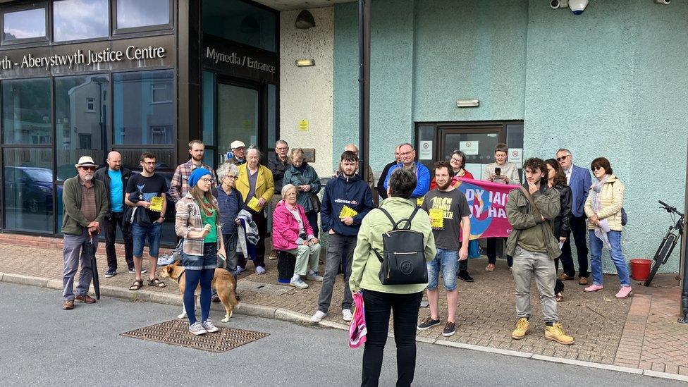 protestors outside the Aberystwyth Justice centre