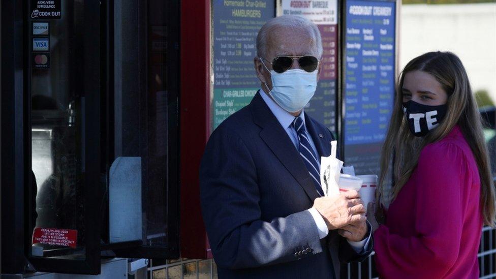 Joe Biden and granddaughter Finnegan Biden hold milkshakes in North Carolina