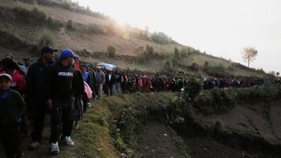 People carry the coffin with the body of Rivaldo Jimenez Ramirez, a migrant killed in the Mexican state of Tamaulipas while trying to reach the US, during his funeral in Comitancillo, Guatemala, March 14, 2021.