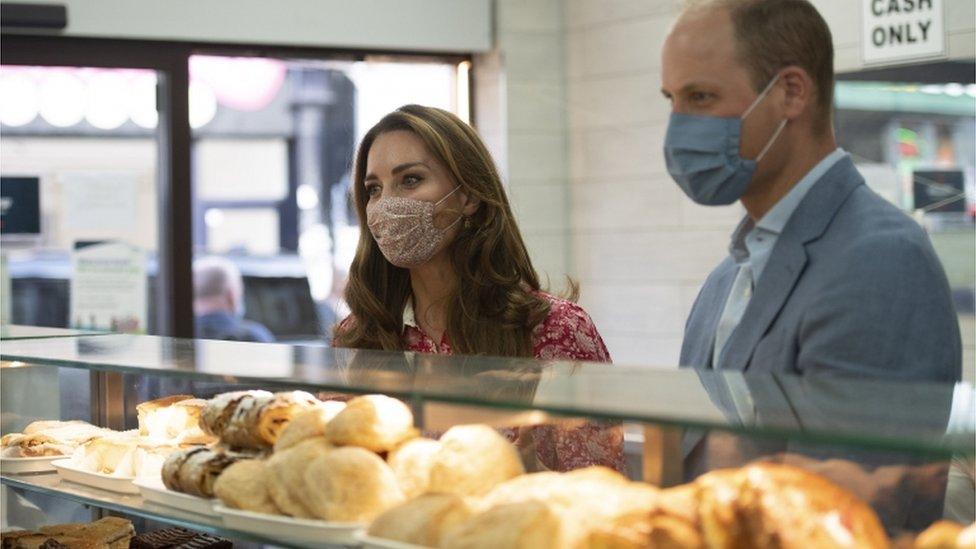 Duke and Duchess of Cambridge at a bakery counter