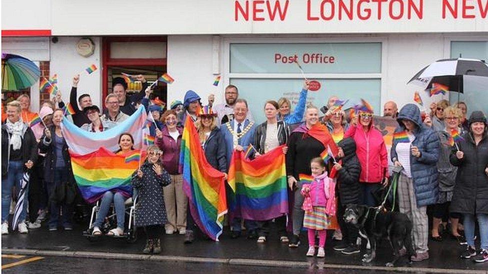 People staging Pride rally outside a post office