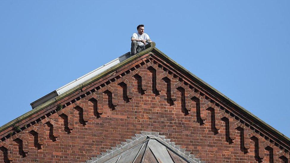 Stuart Horner on top of roof