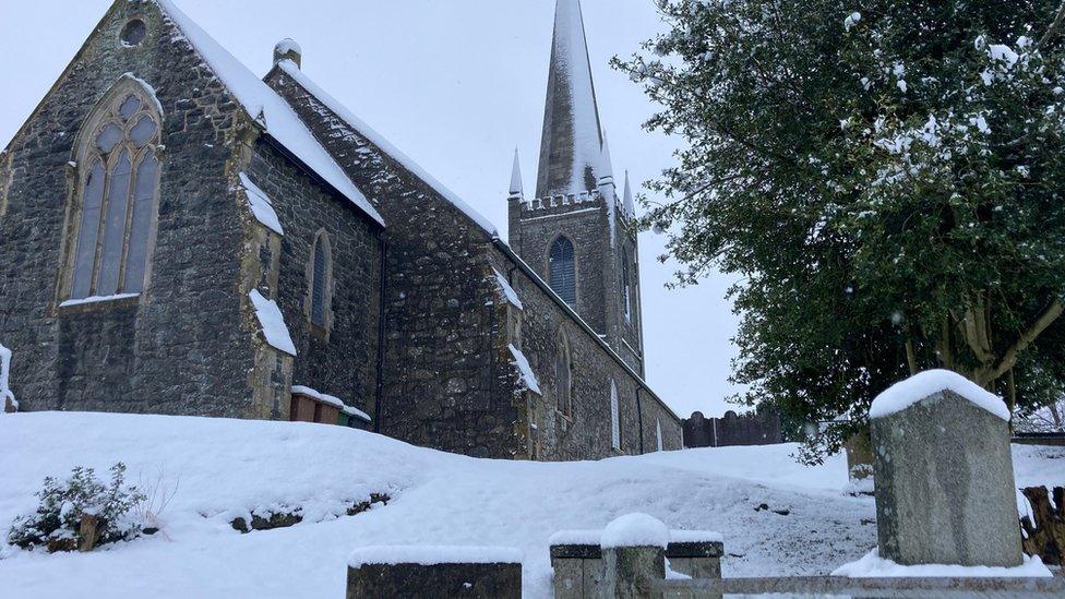 A church is iced in a snowy frosting