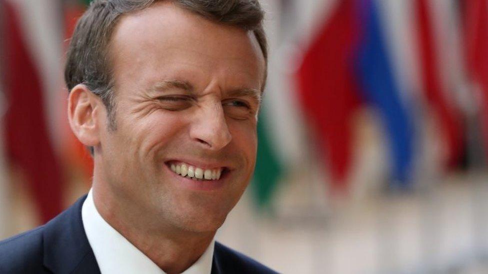 French President Emmanuel Macron reacts as he arrives for the European Union leaders summit in Brussels