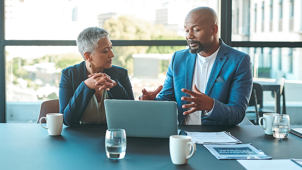 Man and woman in business meeting