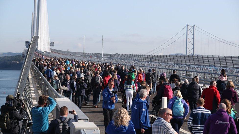 People walking across Queensferry Crossing