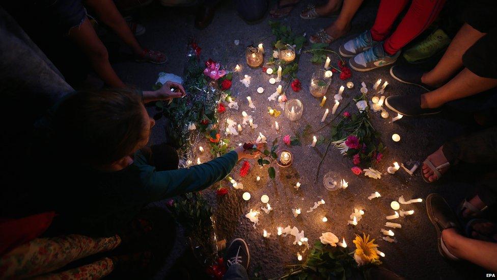 People gather for a candlelight rally in solidarity with the victims of a deadly attack on the Imperial Marhabada hotel, in Sousse, Tunisia, 27 June 2015