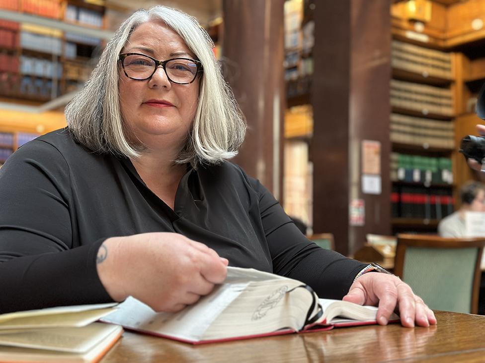 Karen Dovaston in a library