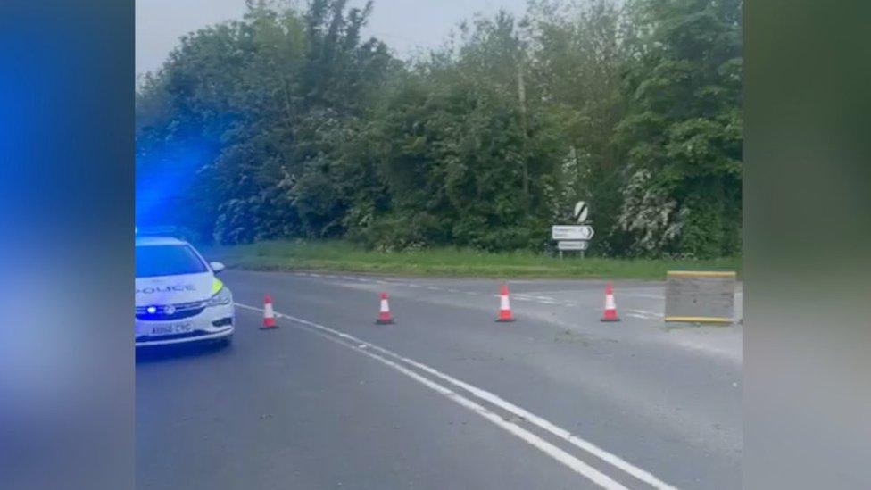 Police car and road closure