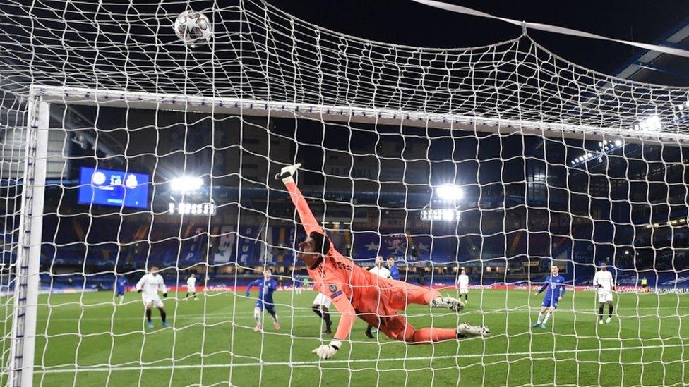 Real Madrid"s Thibaut Courtois makes a save