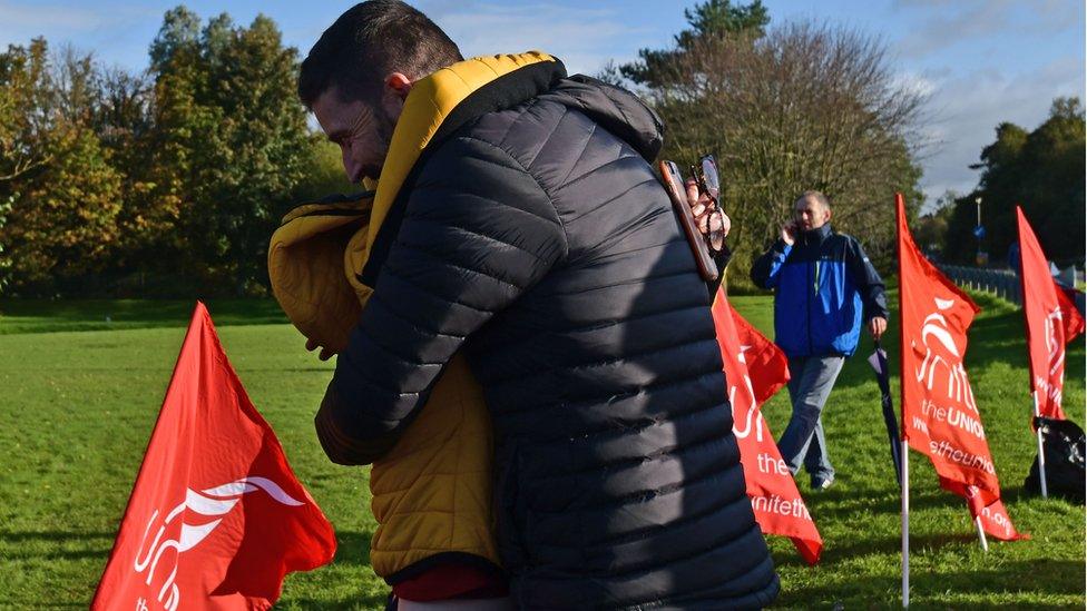 Wrightbus workers hug on hearing news of a deal