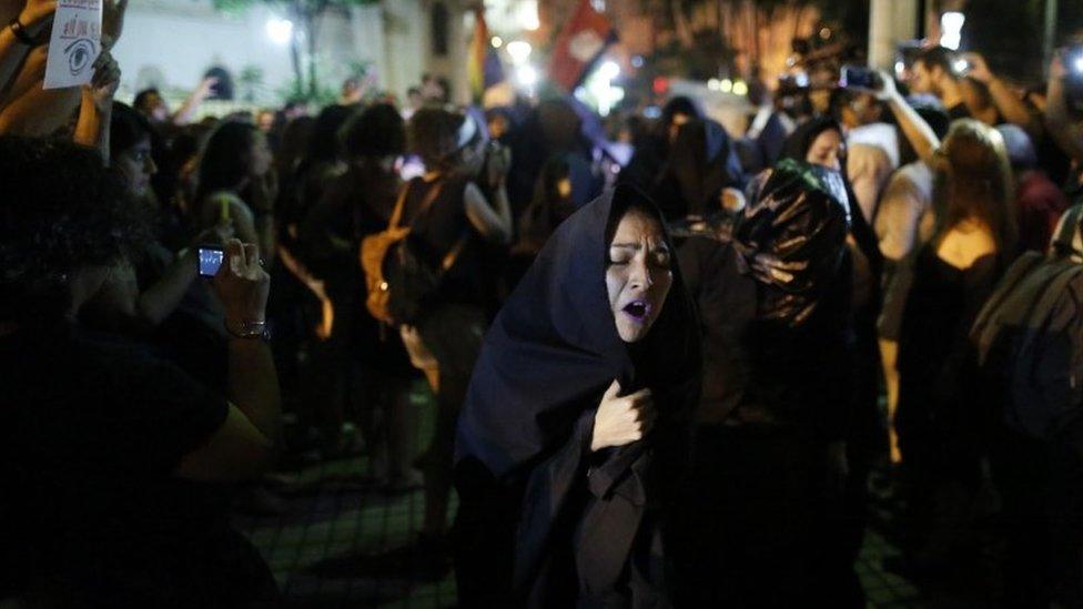 Women protest against gender violence in Asuncion, Paraguay, Wednesday, Oct. 19, 2016