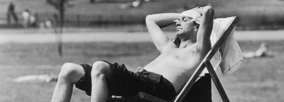 A man sunbathing in Kensington Gardens in the summer of 1976