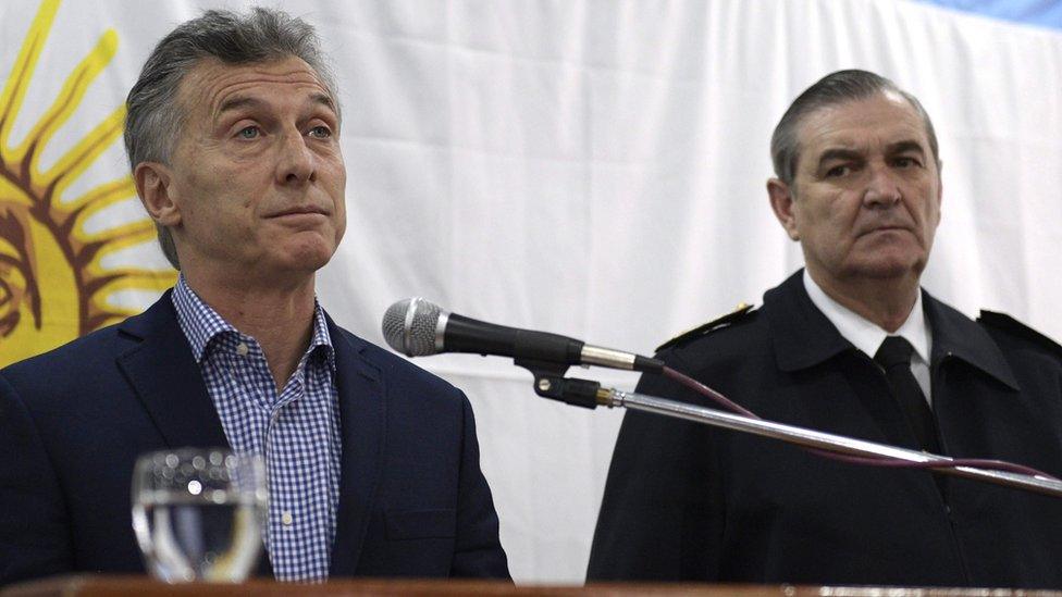 Argentine President Mauricio Macri (L) gestures next to Vice Admiral Marcelo Srur, during a press conference in Buenos Aires on 24 November 2017