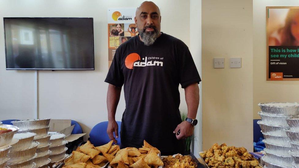 Shujah Saklain, co-founder of the Children of Adam charity in Peterborough at a bake sale