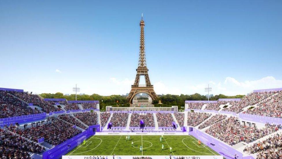 Blind football played in champ de mars, with eiffel tower in the background