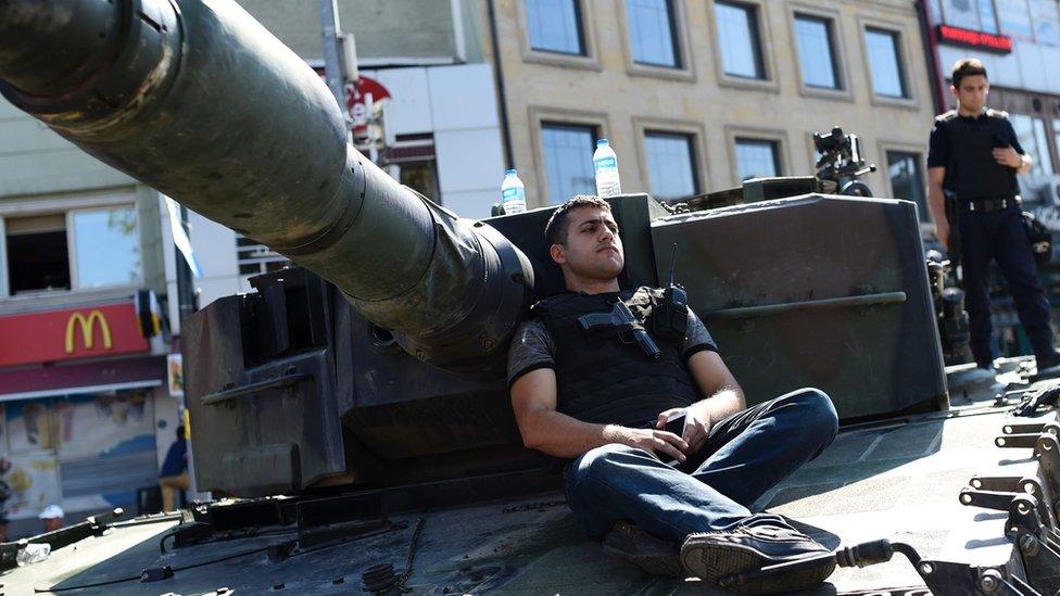 Turkish police sit on a tank as after taking over a military position at the Anatolian side at Uskudar in Istanbul (16/07/2016)