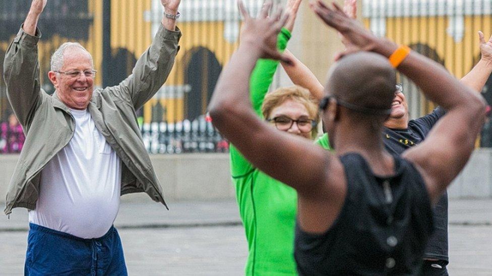 Handout picture released by the Peruvian presidency showing new Peruvian President Pedro Pablo Kuczynski 77, and part of his cabinet taking a morning workout session in the main patio of the presidential palace in Lima on August 4, 2016