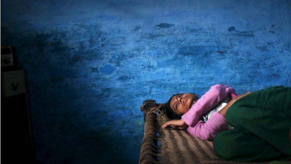 Sajida Saifi, daughter of Akhalaq Saifi, who was killed by a mob, mourns his death inside her house at Bisara village in Uttar Pradesh, India, October 2, 2015