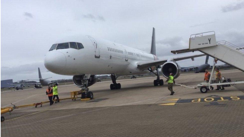 A charter flight from Moscow lands at RAF Brize Norton