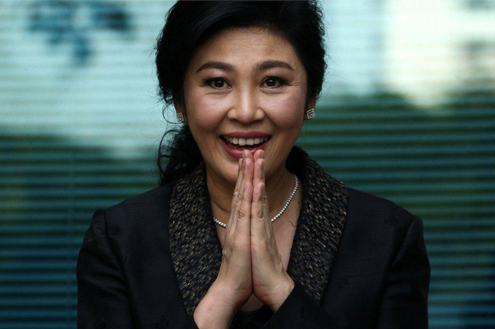 Ousted former Thai prime minister Yingluck Shinawatra greets supporters as she arrives at the Supreme Court in Bangkok, Thailand, August 1, 2017.